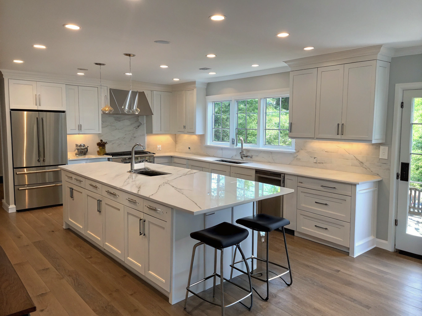 Modern kitchen with custom cabinetry and stone countertops
